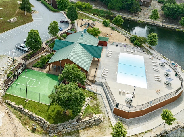 birds eye view of property with a water view