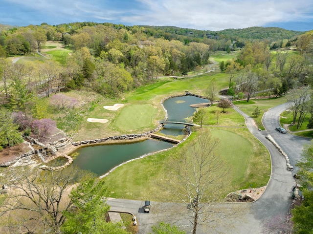 drone / aerial view featuring a water view and golf course view