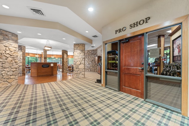 welcome area with visible vents and ornate columns
