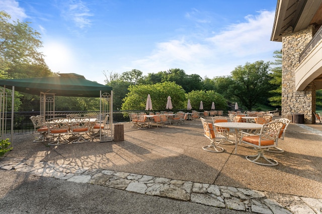 view of patio / terrace featuring outdoor dining area and a gazebo