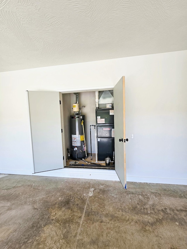 garage with water heater and heating unit