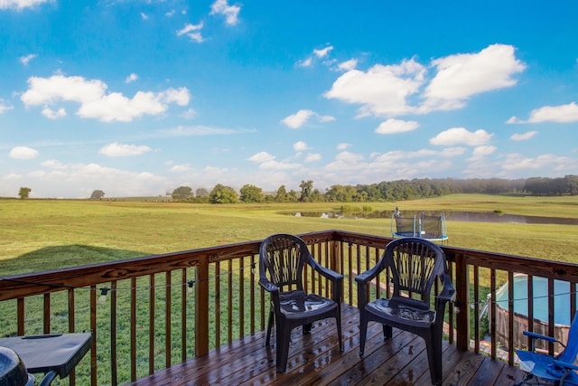 wooden terrace featuring a yard and a trampoline