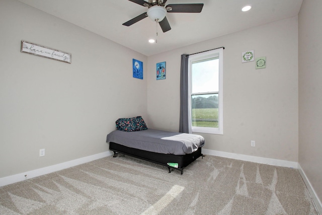 carpeted bedroom with ceiling fan, baseboards, and recessed lighting