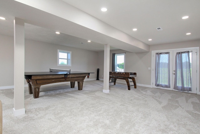 game room with french doors and light colored carpet