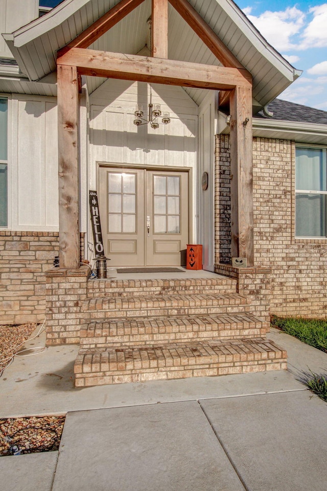 view of exterior entry with a porch