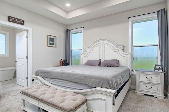 bedroom featuring light colored carpet and recessed lighting