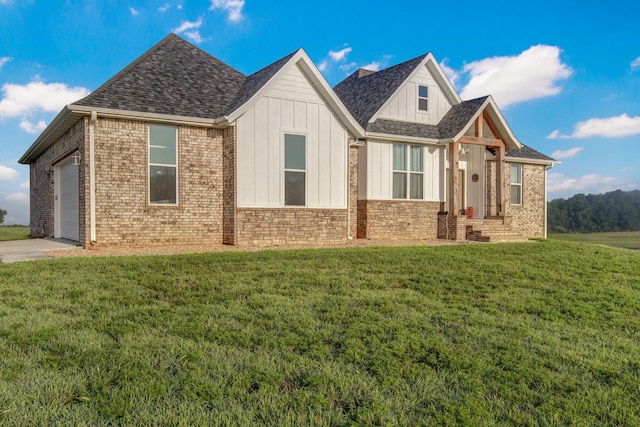 view of front of property with a front lawn and a garage