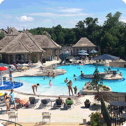 view of swimming pool featuring a water slide and a patio