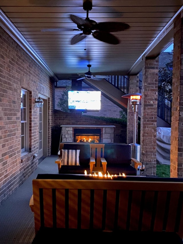 view of patio featuring ceiling fan