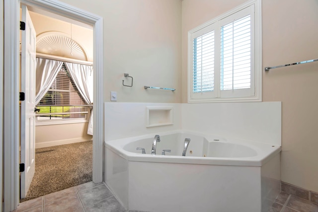 bathroom featuring tile patterned flooring and a washtub