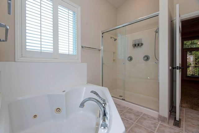 bathroom with shower with separate bathtub, plenty of natural light, and tile patterned floors