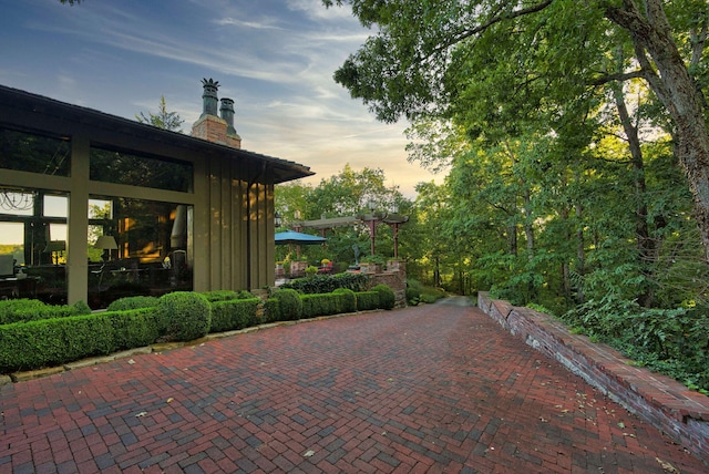 view of patio terrace at dusk