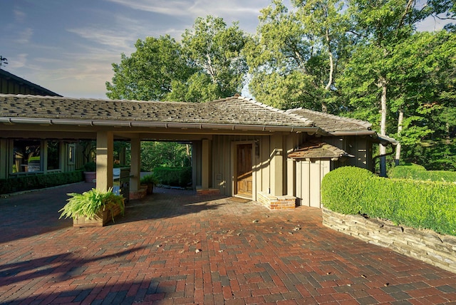 view of side of home featuring a patio area