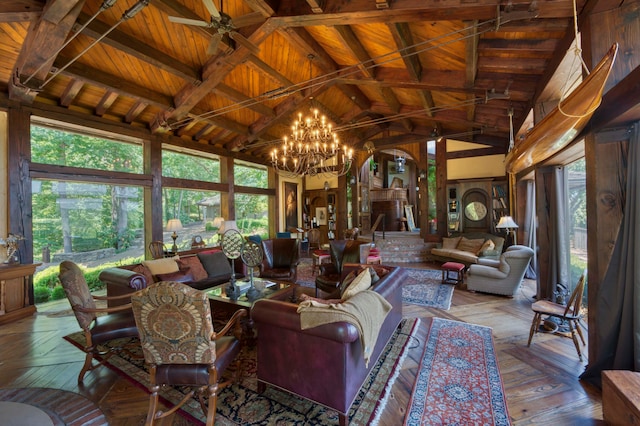 interior space with beamed ceiling, wood ceiling, high vaulted ceiling, an inviting chandelier, and light wood-type flooring