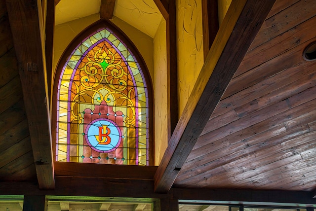 exterior details featuring beamed ceiling