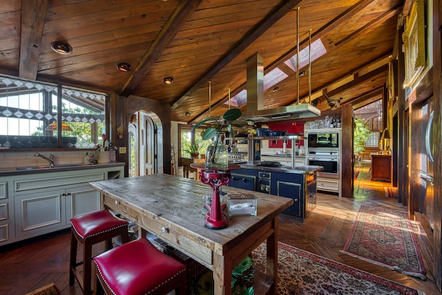 interior space with a skylight, dark parquet flooring, sink, and wooden ceiling