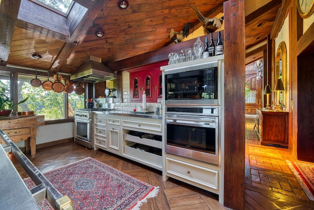 kitchen with wood ceiling, backsplash, extractor fan, appliances with stainless steel finishes, and lofted ceiling with skylight