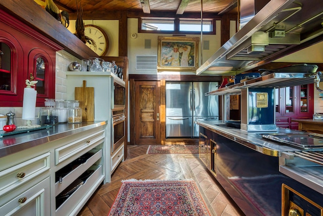 kitchen featuring stainless steel counters, stainless steel appliances, and wood ceiling