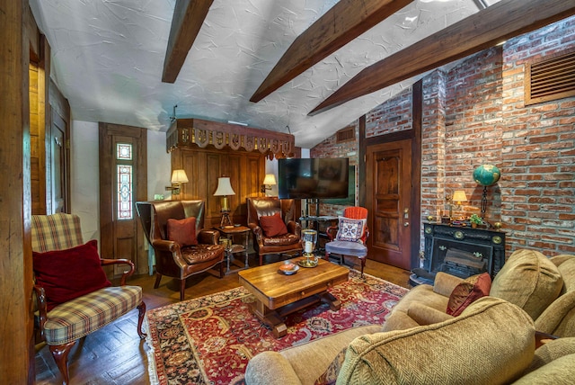 living room featuring a fireplace, brick wall, vaulted ceiling with beams, and hardwood / wood-style flooring