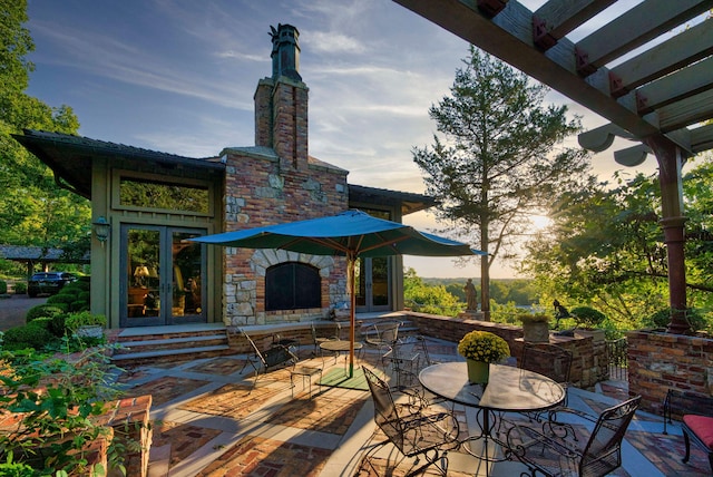 view of patio terrace at dusk