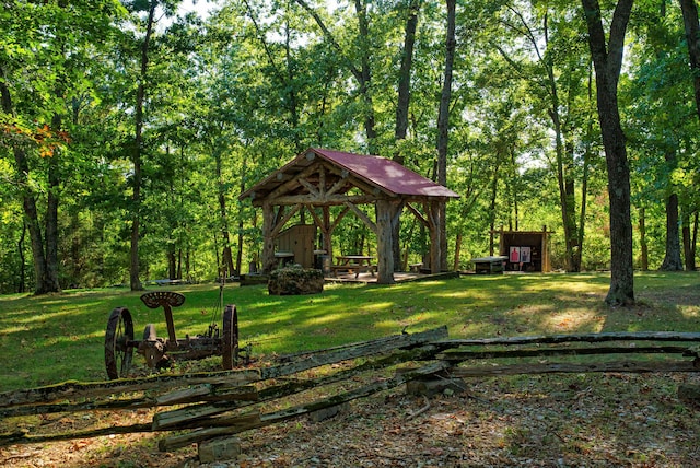 view of property's community with a gazebo and a yard