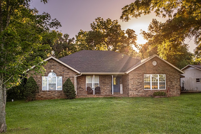 ranch-style house with a yard