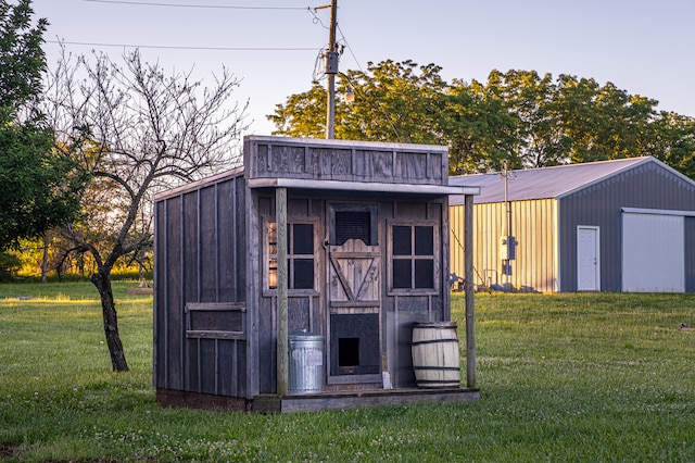 view of outbuilding featuring a yard