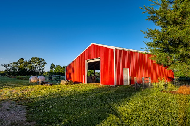 view of outbuilding with a yard