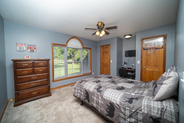 carpeted bedroom featuring ceiling fan