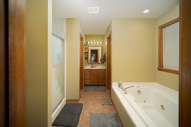 bathroom with vanity, separate shower and tub, and tile patterned floors