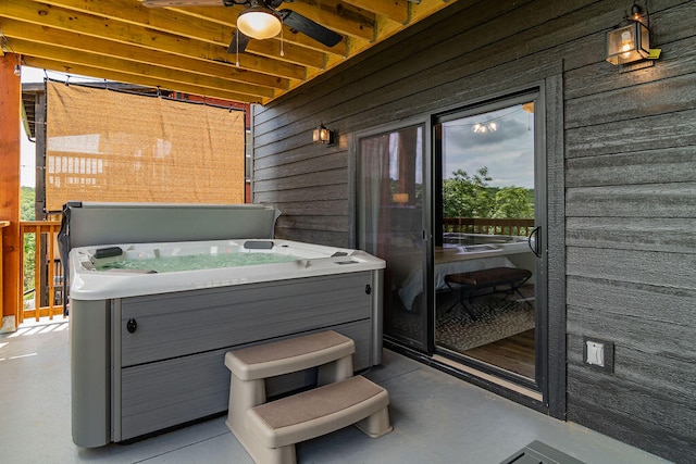 view of patio featuring a hot tub and ceiling fan