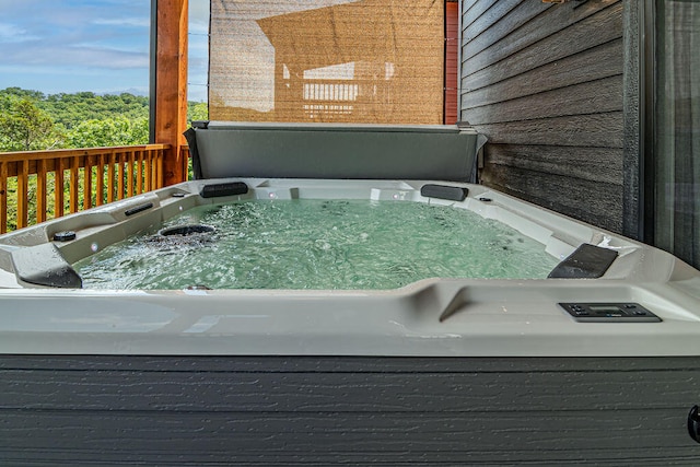 exterior details featuring a hot tub