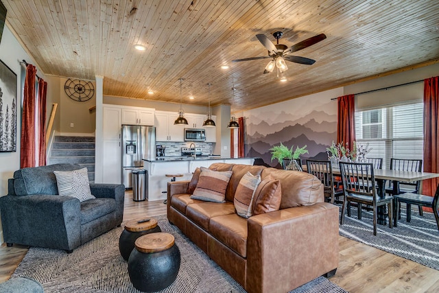 living room with wooden ceiling, light wood-type flooring, and ceiling fan