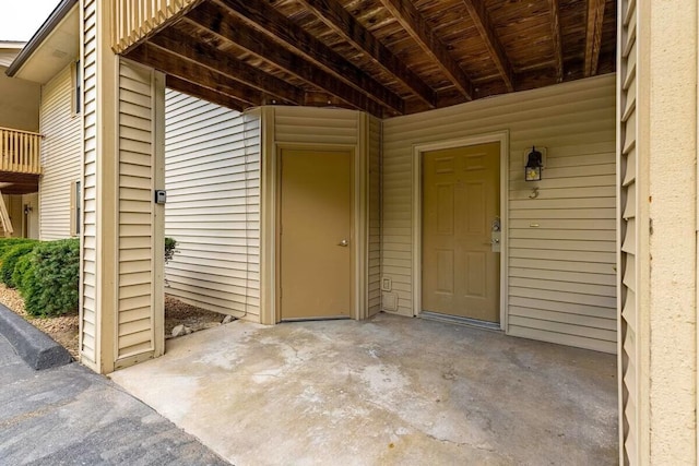 view of exterior entry featuring a patio area