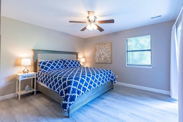 bedroom with hardwood / wood-style flooring and ceiling fan