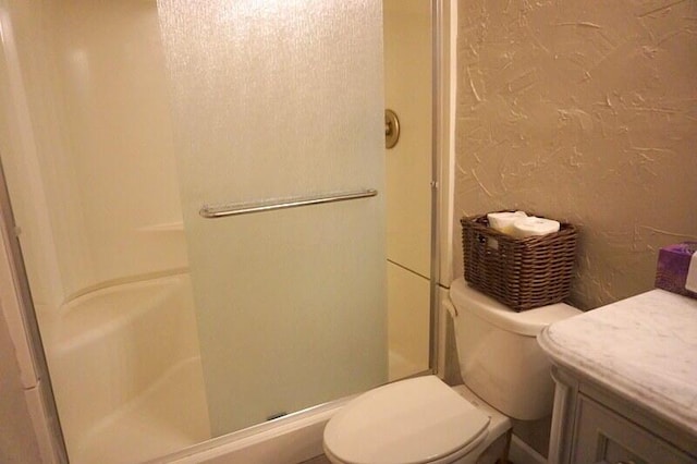 320 Turnberry Dr Unit 3, Branson, MO 65616 - full bathroom featuring a shower stall, toilet, and a textured wall