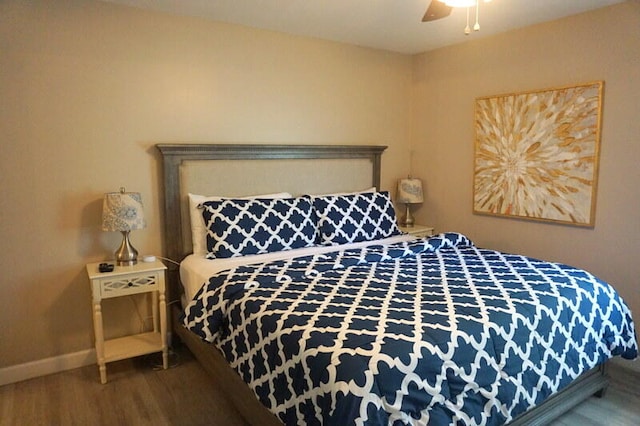 bedroom featuring hardwood / wood-style flooring and ceiling fan