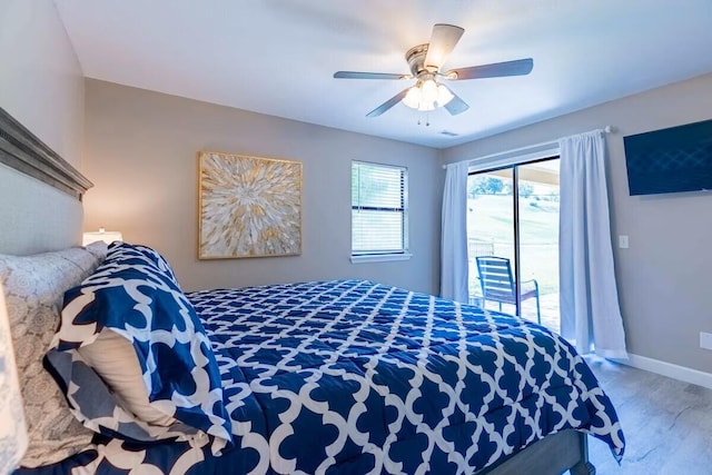 bedroom with access to exterior and ceiling fan