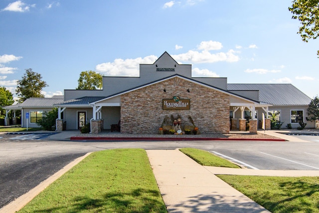 view of building exterior with uncovered parking