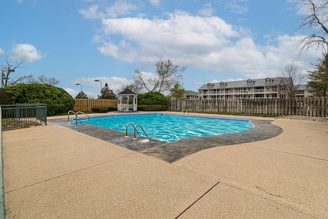 view of swimming pool with a fenced backyard, a gazebo, a patio, and a fenced in pool