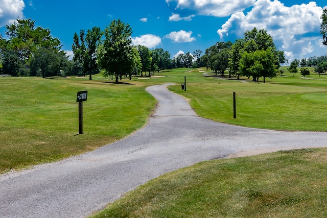 view of property's community featuring a lawn