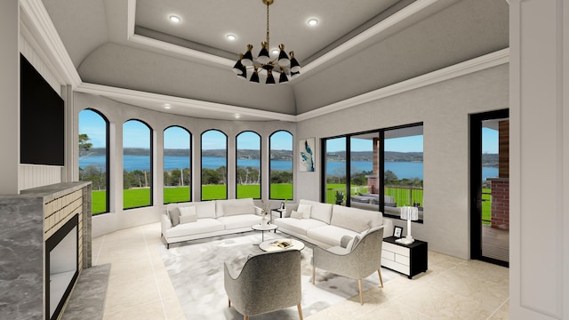 tiled living room with a water view, ornamental molding, a chandelier, and a raised ceiling