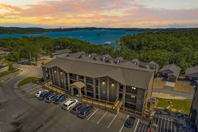 aerial view at dusk with a water view