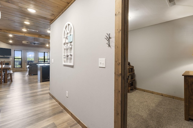 hall with wooden ceiling and hardwood / wood-style flooring