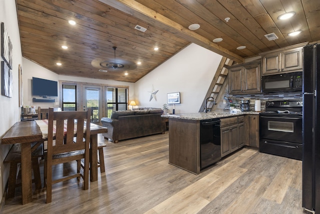 kitchen with lofted ceiling, wood ceiling, and black appliances