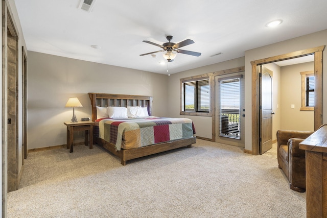 bedroom featuring access to outside, light colored carpet, and ceiling fan