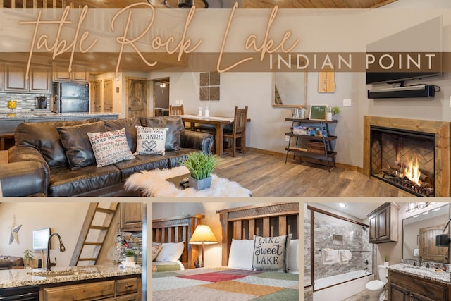 living room featuring a fireplace, sink, and hardwood / wood-style floors