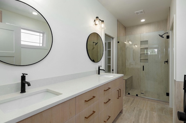 bathroom with walk in shower and vanity