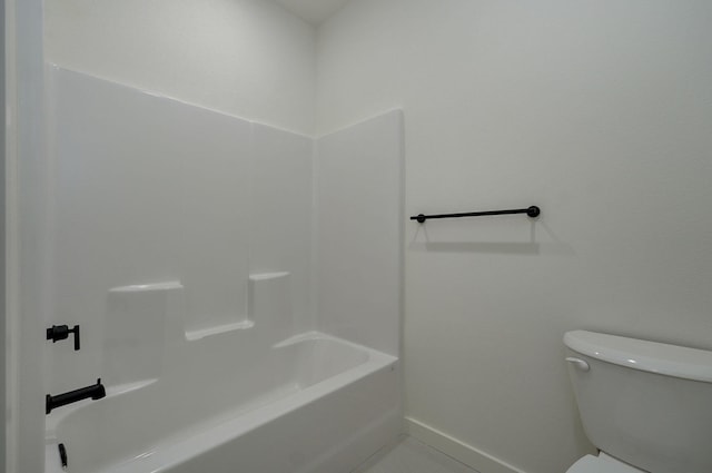 bathroom with toilet and tile patterned floors