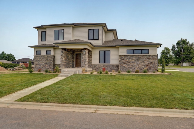 prairie-style home featuring a front lawn